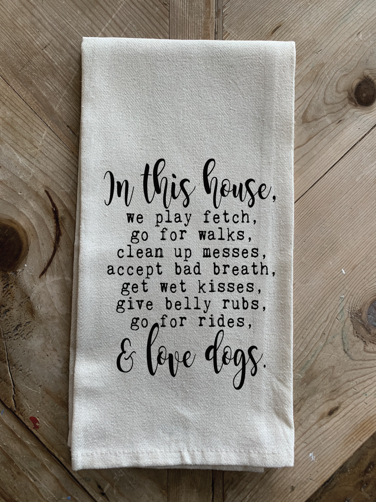 In this house, we play fetch, go for walks, clean up messes, accept bad breath, get wet kisses, give belly rubs, go for rides, & love dogs.