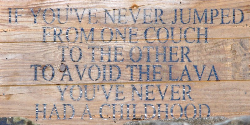 If you've never jumped from one couch to the other to avoid the lava you've never had a childhood. / 14"x6" Reclaimed Wood Sign