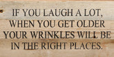 If you laugh a lot, when you get older your wrinkles will be in the right places. / 14"x6" Reclaimed Wood Sign